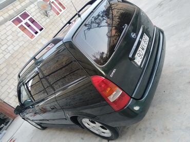 Opel: Opel Astra Caravan (universal) – tünd yaşıl rəng • Kuzov: universal — 5