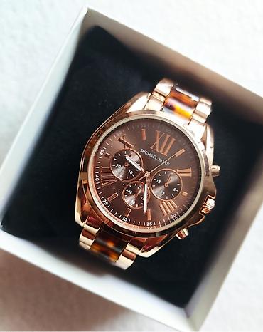 prada naocare za sunce: Fantastičan sat u braon boji . Brojčanik je prečnika 44 mm — 1