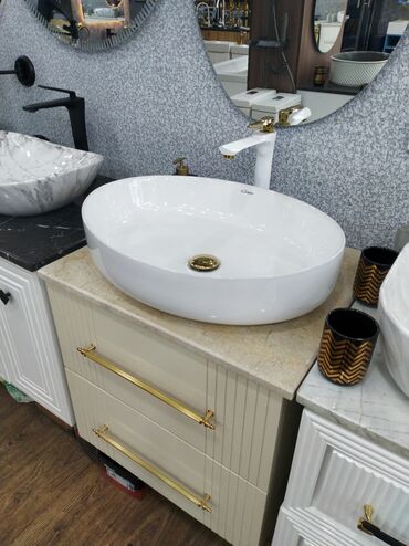 metbex tavanlari: Ağ rəngli, oval formalı, keramika materialdan hazırlanmış umivalnik