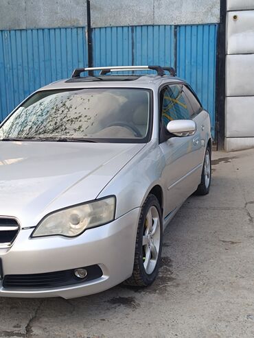 легковой машина: Представляем универсал Subaru Legacy в серебристом цвете, оснащенный