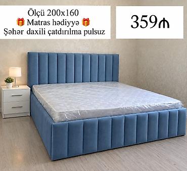 Mavi rəngli, yumşaq toxumalı, dik şaquli tikişli başlıq və korpus