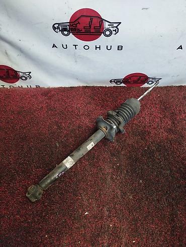 Амортизатор задний Mazda Demio DW3W (поколение DW), двигатель 1.3/1.5