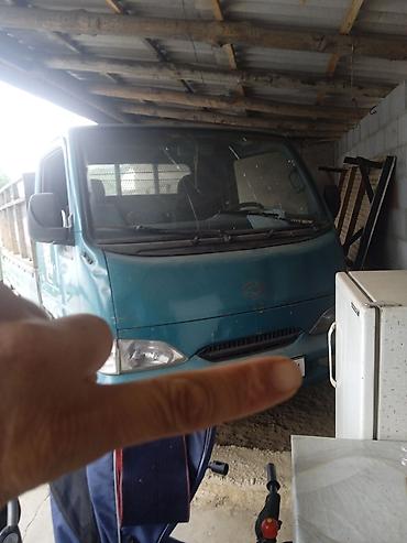 авто домик: Грузовой бортовой малотоннажный автомобиль синего цвета. Основные — 2