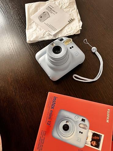 мереке видео: Fujifilm Instax mini 12 — мгновенная камера в цвете Pastel Blue — 3