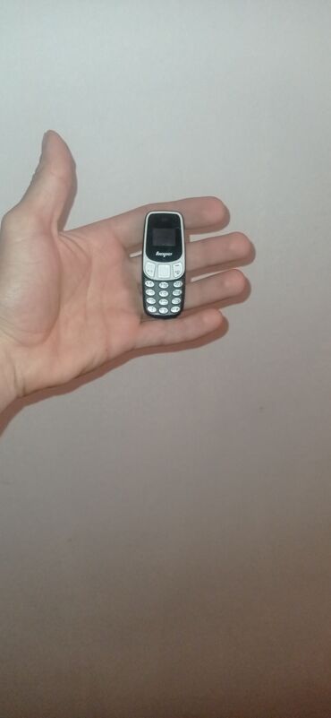 телефон fly m100: Su qiymətinə telfon mini