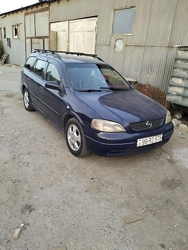 prius baqaj: Opel Astra Caravan (universal) – tünd mavi rəng. Xüsusiyyətlər: - — 1