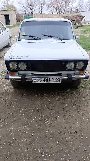 2106 ваз: VAZ 2106, ağ rəng, sedandır. Ön hissədə ikili dəyirmi faralar, qara — 1