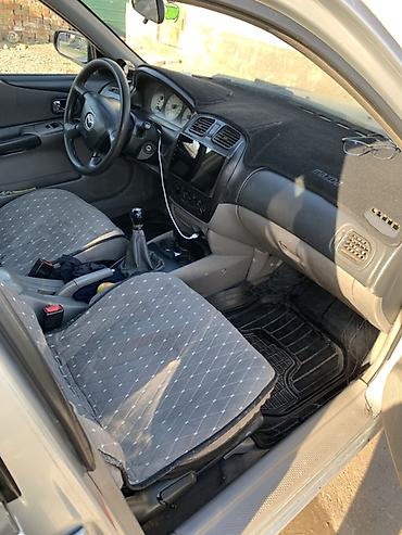 стекло на одиссей: Mazda 323: 2003 г., Механика, Бензин, Универсал — 4