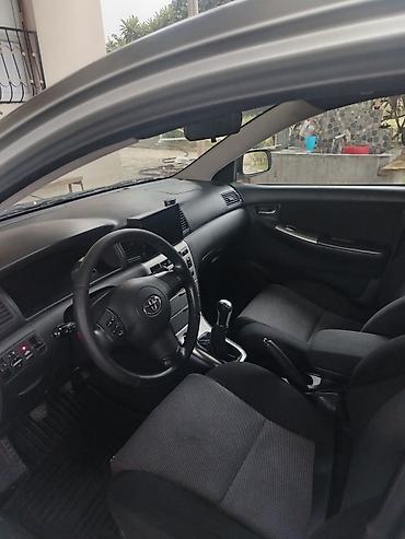 tra: Toyota Corolla hatchback (E120) – gümüş rəng. Texniki xüsusiyyətlər — 10