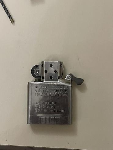 ziyafet donu vilyur s: Təptəzədir təkcə qabı yoxdur orjinaldır Məhsul: Zippo benzinli alışqan — 1