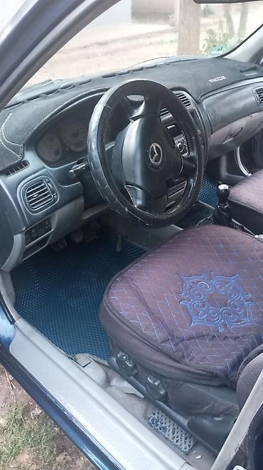 subaru legaci: Mazda 323: 2002 г., Универсал — 7