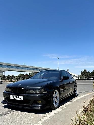 e39 guzgu: BMW 5 Series E39 sedan – qara rəng, M-paket üslublu eksteryer — 3