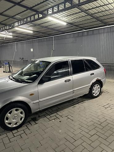мини электро: Mazda 323: 2003 г., 1.3 л, Механика, Бензин, Хэтчбэк — 6