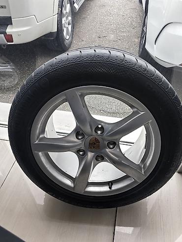 porsche disk: Məhsul: Porsche loqolu yüngül lehimli disk + Continental şin komplekti — 1