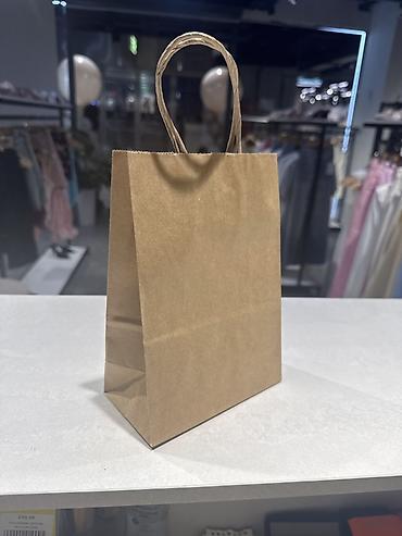 Пакеты: Крафтовые бумажные пакеты с кручеными ручками 15*8*21см(1500 штук,цена — 1