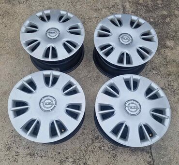 Gume i felne: Komplet od 4 čelične felne sa originalnim Opel ratkapama. - na lalafo.rs — 1 Gume i felne: Komplet od 4 čelične felne sa originalnim Opel ratkapama. - — 1