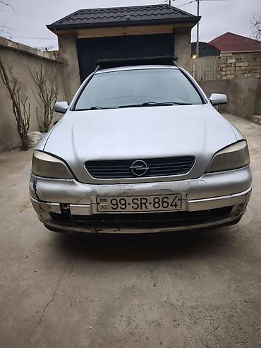 Opel: Opel Astra Caravan (universal) – gümüş rəngli kuzov, 5 qapı, dam — 3