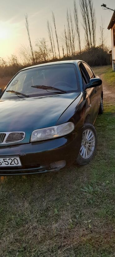 Daewoo: Model: Daewoo Nubira (sedan) Rəng: Tünd yaşıl Yanacaq növü: Benzin — 9