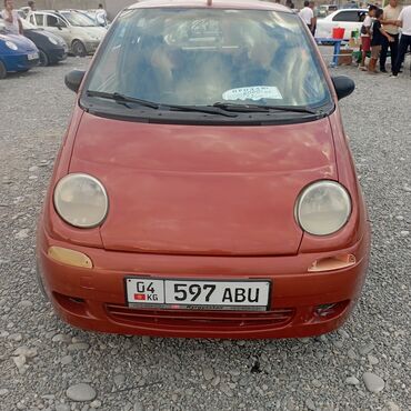 кредит на машину: Пятидверный компактный хэтчбек Daewoo Matiz кирпично-красного цвета