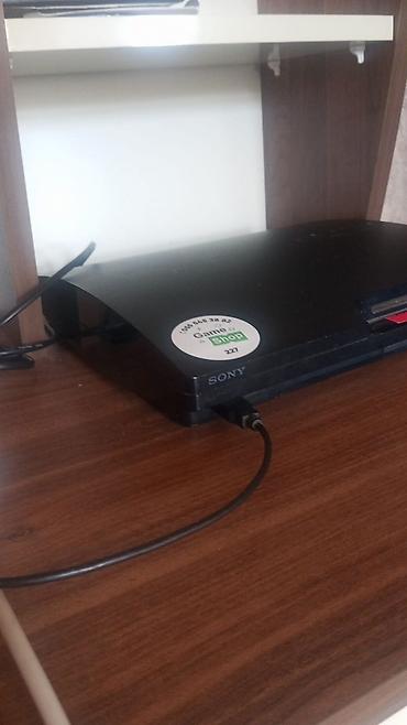 nvidia geforce gt 730: Sony PlayStation 3 (PS3) Slim oyun konsolu - Rəng: qara, üst qapaqda — 1