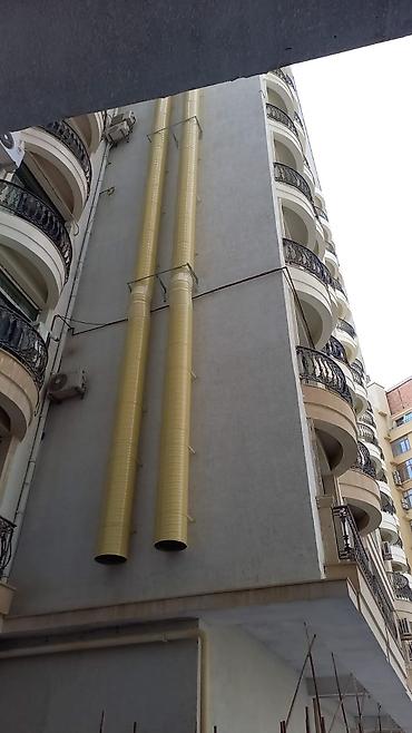 generator təmiri: Bina fasadında sənaye tipli havalandırma/çəkiş kanalları və — 1