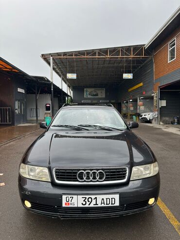 Audi: Автомобиль Audi A4 Avant в кузове универсал, окрашенный в темно-серый