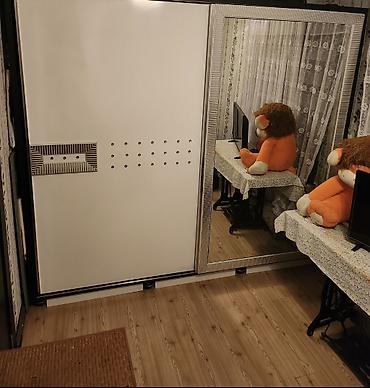 Dolablar: Ağ rəngli sürgülü qapılı geyim dolabı - 2 qapılı konstruksiya: biri — 1