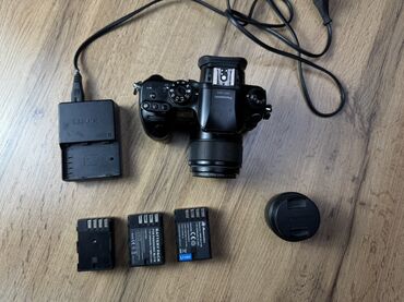 стабилизатор для фотоаппарата: Беззеркальная камера Panasonic Lumix GH4 с объективом. Модель GH4