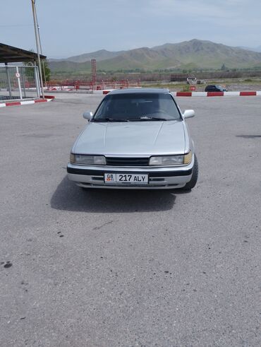 наклейки для авто: Mazda 626: 1991 г., 2.2 л, Бензин, Седан