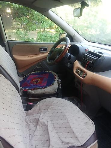 тонировка стекл: Nissan Almera Tino: 2000 г., Механика, Минивэн — 4