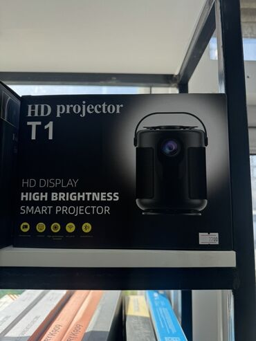 портативный монитор: Портативный HD-проектор модели T1 обеспечивает яркое изображение и