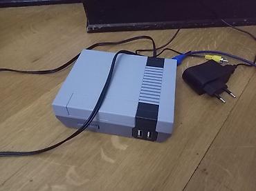 islenmis mator: Klassik NES üslubunda retro oyun konsolu. Dəstdə konsol, bir ədəd oyun — 2