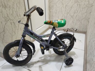gitara uşaq ucun: 12lik uşaq velosipedi. Normal sürülür. Şəkildəki kimidir. ünvan Elmlər