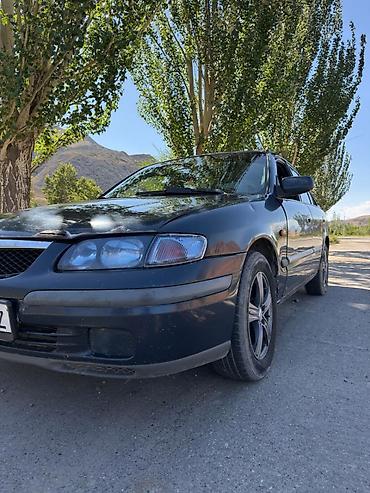 385 55: Mazda 626: 1997 г., 1.8 л, Механика, Газ, Седан — 8