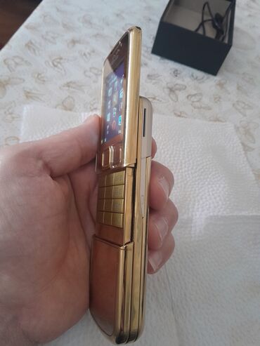 Digər mobil telefonlar: Qızılı korpuslu sürüşdürmə mexanizmalı düyməli mobil telefon — 7