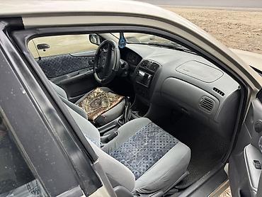 пленка авто: Mazda 323: 1998 г., Механика, Бензин, Седан — 4