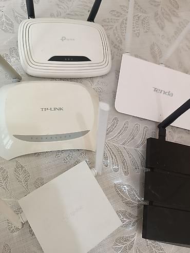 ucuz wifi modem: Wi‑Fi routerlər toplusu Brendlər: TP‑Link və Tenda. Korpusda müxtəlif — 3