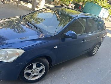 kia ceed 2007: Kia Ceed SW (universal) – mavi rəngli, rahat və geniş ailə avtomobili — 7