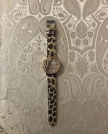 Digər: Qadın qol saatı - Korpus: qızılı tonlu dairəvi korpus, kənarı daş — 1