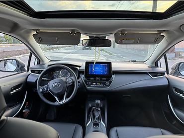 byd e6: Toyota Corolla: 2021 г., 1.8 л, Вариатор, Гибрид, Седан — 5
