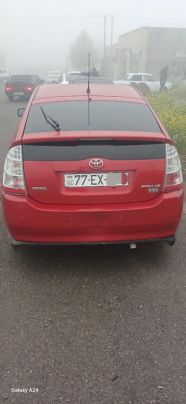 pirus disk: Toyota Prius (2-ci nəsil) – qırmızı rəngdə hibrid hetçbek. Salam — 2