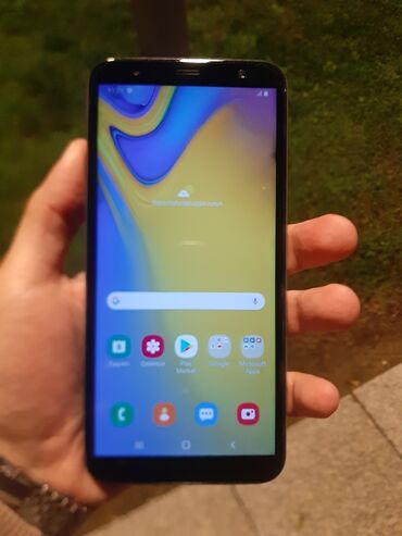 телефон fly cirrus 16: Samsung Galaxy J6 Plus, 32 ГБ, цвет - Серебристый, Отпечаток пальца, Две SIM карты, Face ID