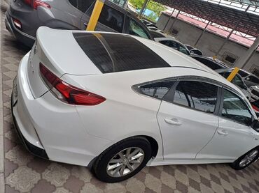 машина расрочка соната лф: Белый седан Hyundai Sonata с плавными линиями кузова и современным