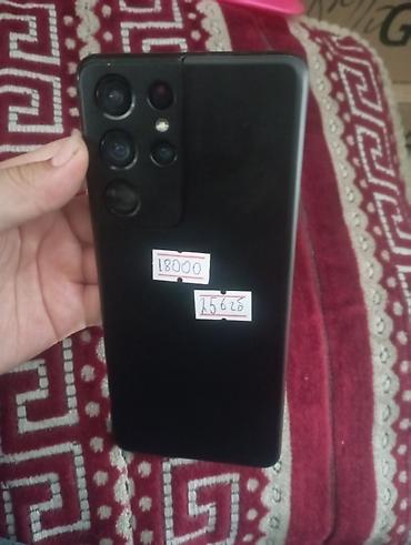 oneplus 7 t: Смартфон Samsung, чёрного цвета, с крупным блоком камер на задней — 1
