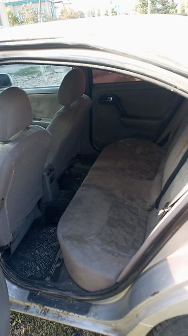 Унаа: Nissan Sunny: 2001 г., 1.6 л, Кол менен иштөөчү, Бензин, Седан — 4