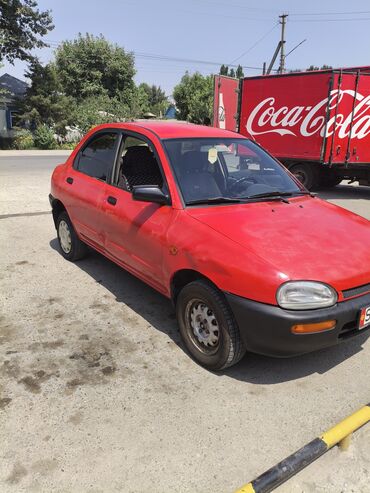 с последуюшим выкупом: Красный седан Mazda 121