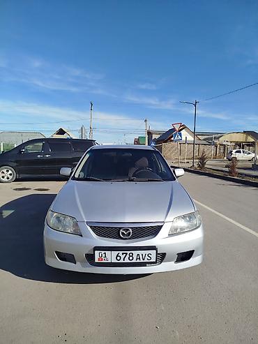 слиндир: Mazda Familia: 2002 г., Механика, Бензин, Хэтчбэк — 9