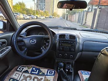 шина ош: Mazda Familia: 2002 г., 1.6 л, Кол менен иштөөчү, Бензин, Универсал — 6