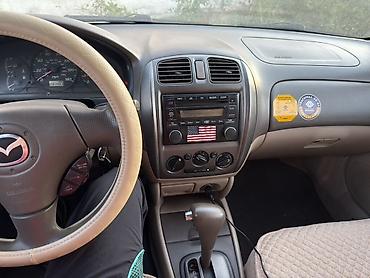 мазда протеге: Mazda Protege: 2002 г., 1.6 л, Автомат, Седан — 7