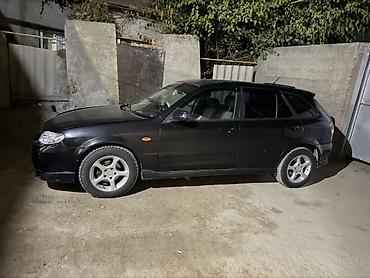 мустанг авто: Mazda 323: 2001 г., 2 л, Автомат, Газ, Универсал — 1